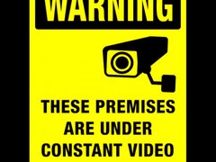 Sign warning these premises are under constant video surveillance
